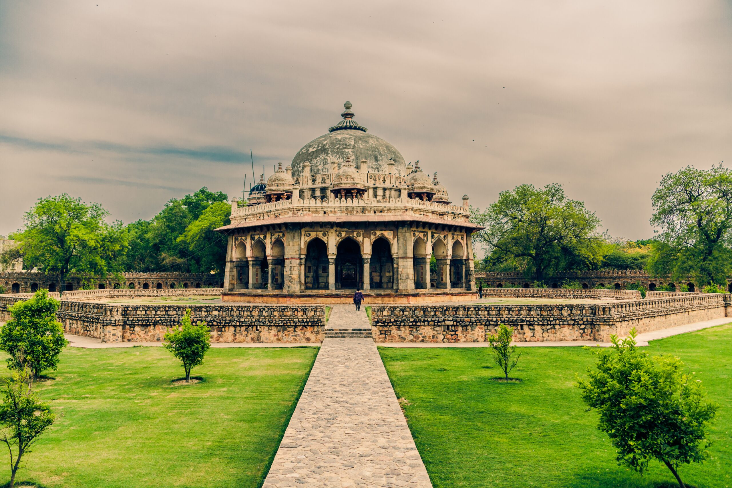 A beautiful shot of Isa Khan's Tomb in Delhi India under a cloudy sky